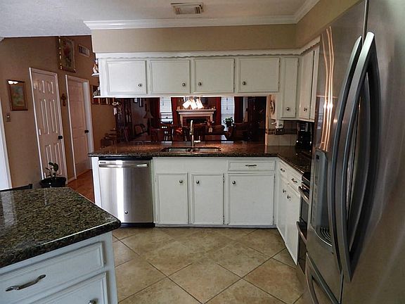 Tile Floors, Tons of Cabinets and Stainless Steel Appliances are just a Few of the Highlights in the Kitchen