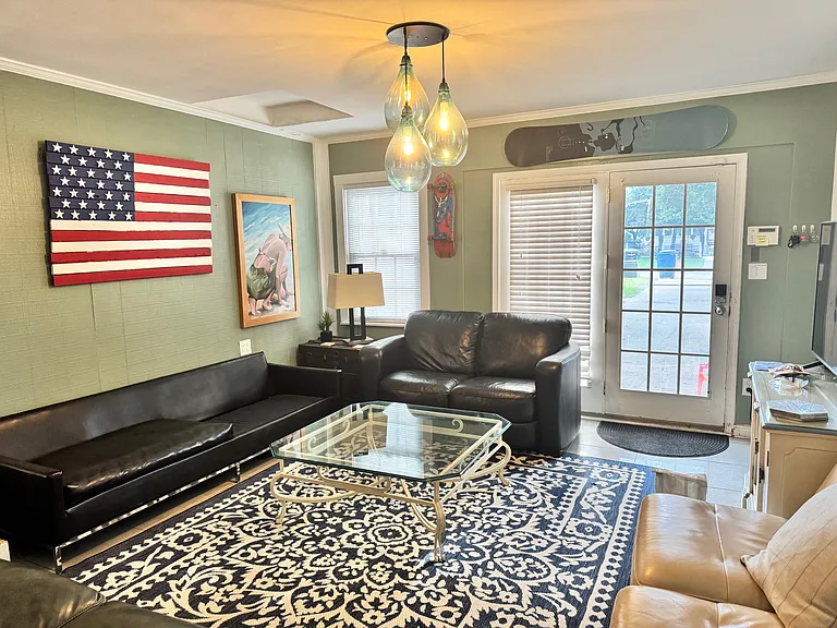 Another view of the awesome family room with views of people walking to & from the beach!