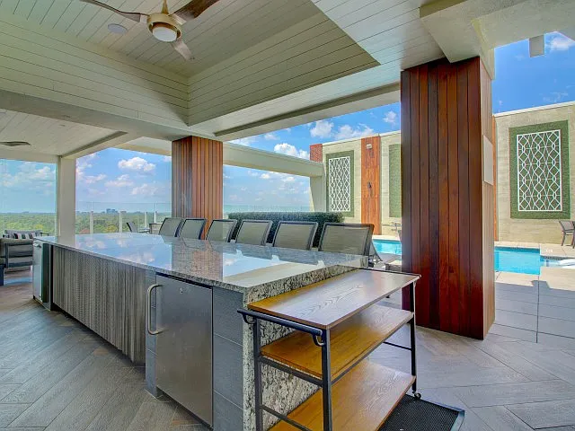 Stylish cooking and entertaining next to a shimmering pool.