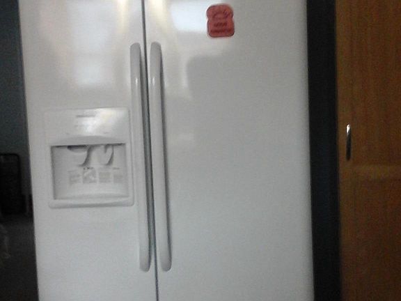 New side by side with ice and water in door.