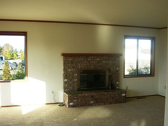 Living Room w/ Wood Burning Fireplace
