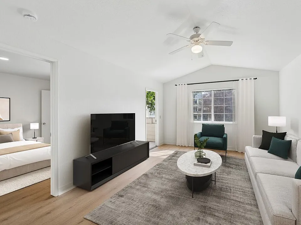 Renovated Package II living room with hard surface flooring