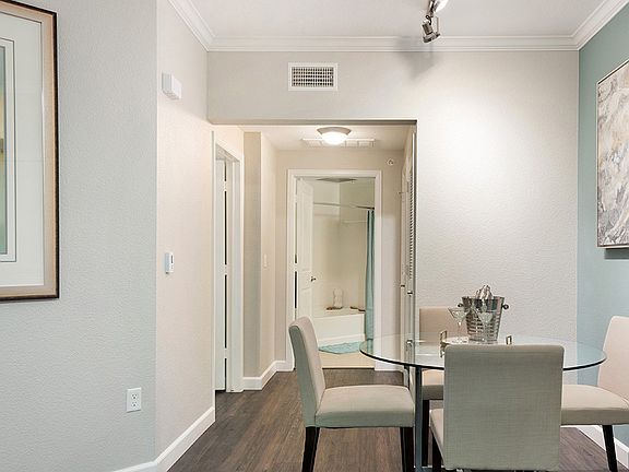 Apartment Dining room with Wood-Style Flooring.
