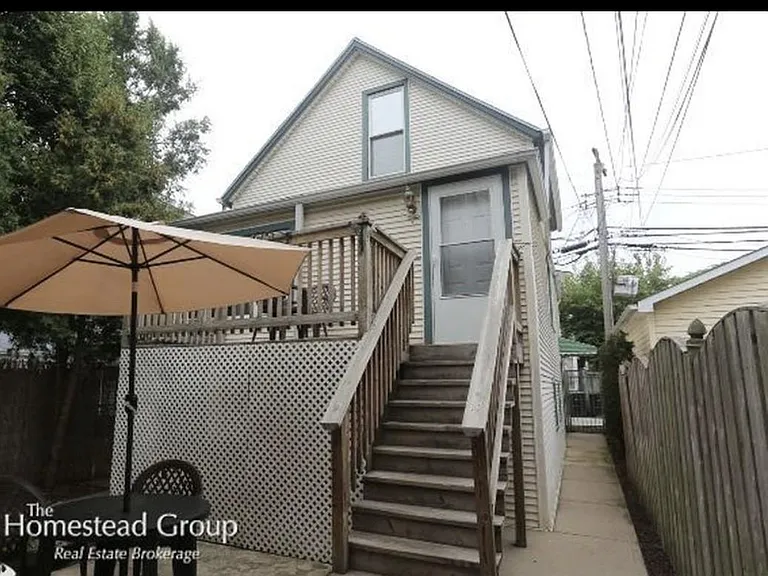 coach house exterior with deck