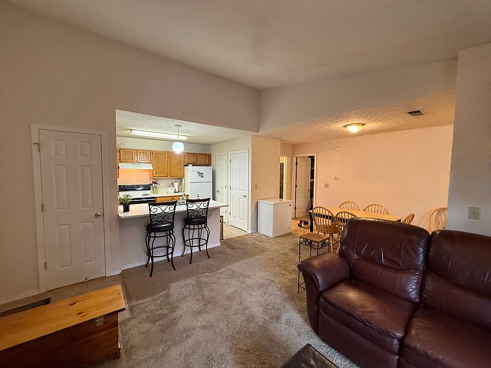 Living area with vaulted ceilings.