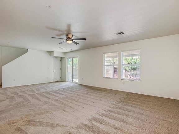 Spacious great room is great for entertaining! Extended linen closet makes use of the space under the stairs!