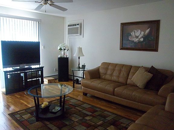 LIVING ROOM WITH DOORS TO BALCONY