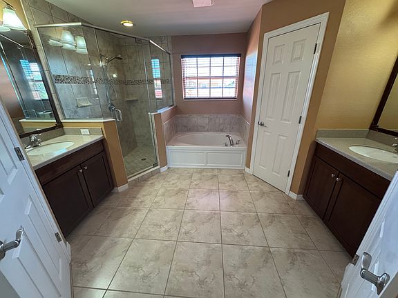 Master Bathroom with His and Her Closet