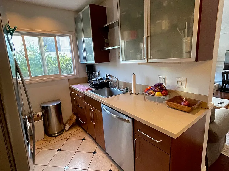 Galley kitchen with stainless steel appliance