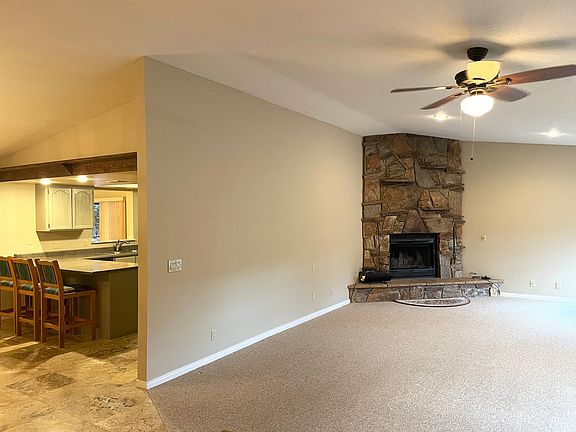 View of living room and kitchen.