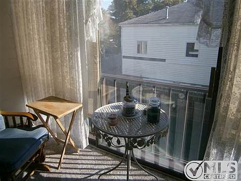 Screened sunroomoverlooking back lawn