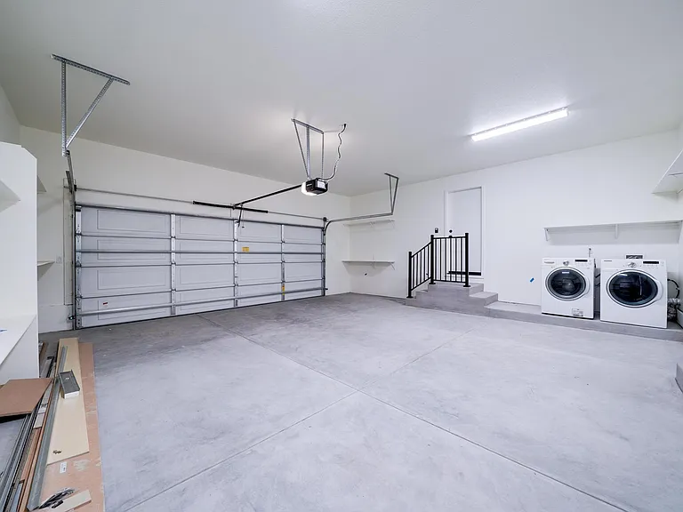 Brand new 2 car garage. New paint, ample shelves/storage, wifi garage door opener (manual openers also available). Garage steps include safety railing. Washer dryer included if tenant desires.