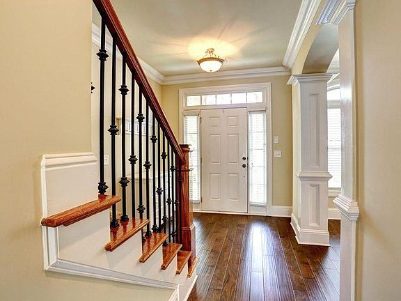 Hallway with newly installed hardwood floor through out the 