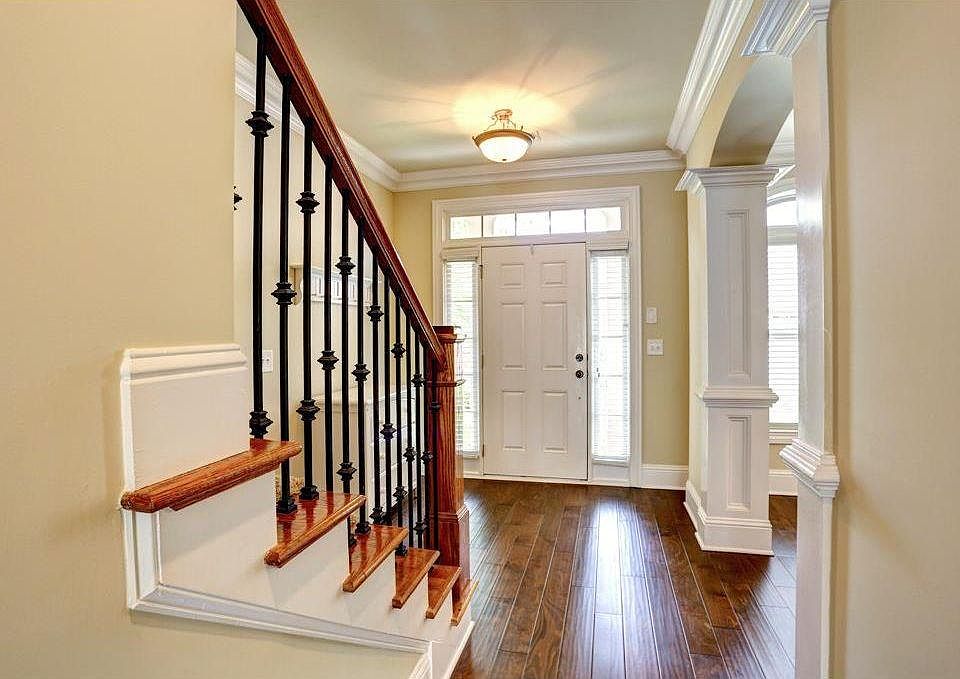 Hallway with newly installed hardwood floor through out the