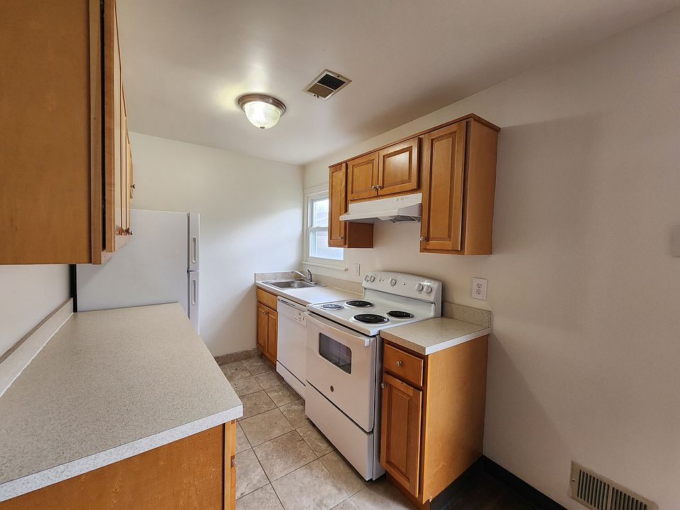 Kitchen: Updated/Renovated Style cabinets with ceramic flooring.
