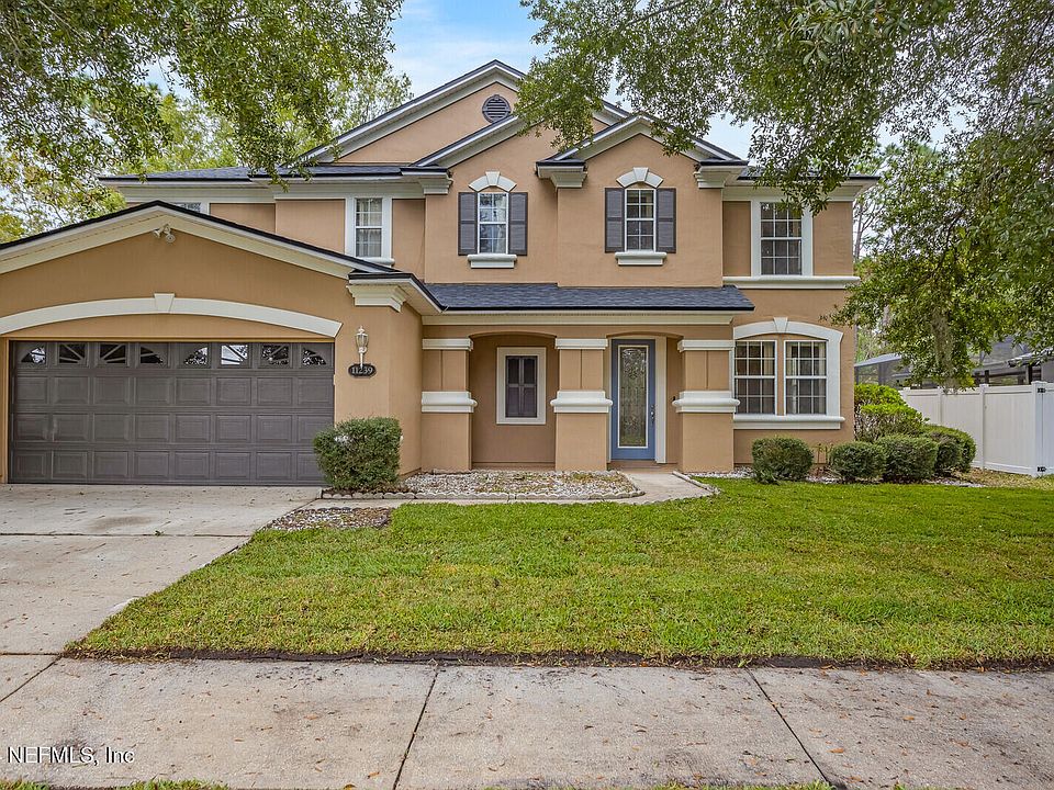 1st image of 11239 JUSTIN OAKS Drive N