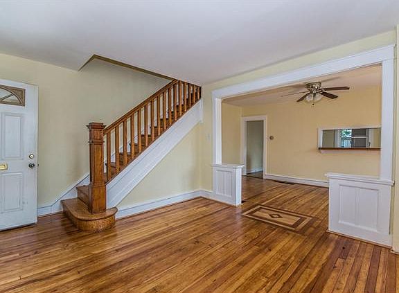 Beautiful wood staircase and inlaid wood floor