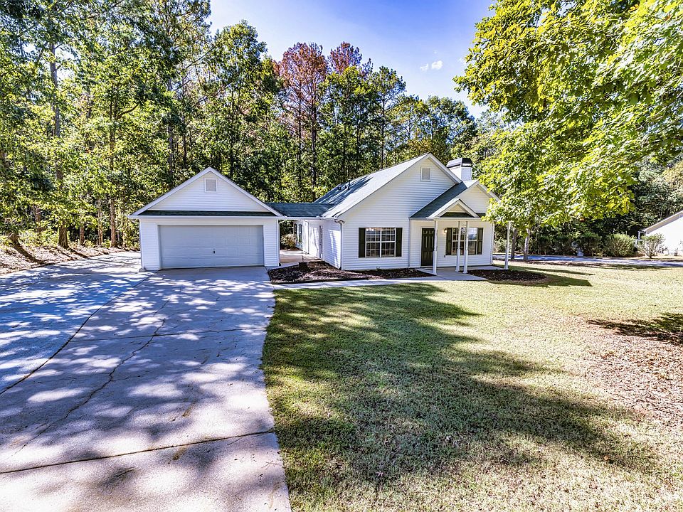 Large double garage with breezeway to kitchen entrance.