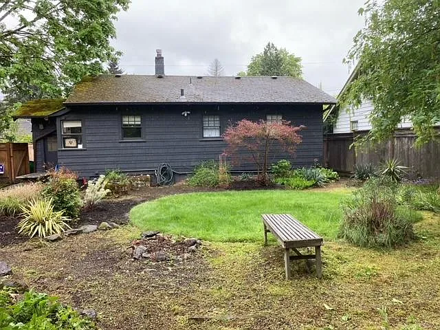 view of back of house from huge backyard
