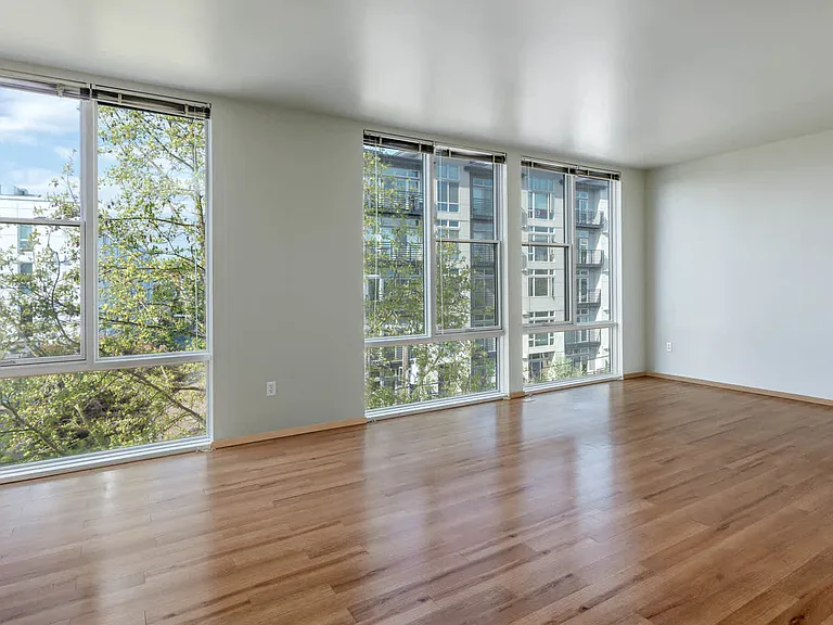 Living Room with Floor-to-Ceiling Windows and Hard Surface Flooring