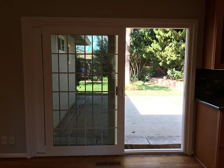Standing in dining room, looking out to the back yard.