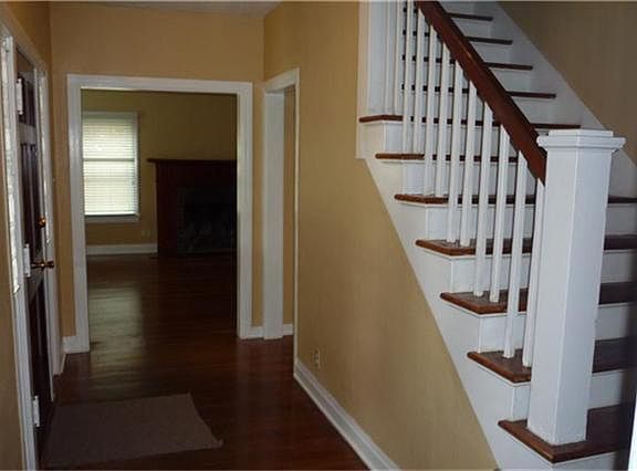 ENTRY WITH BEAUTIFUL HARDWOODS EVEN ON THE STAIRS. THIS MAKE FOR A VERY WELCOMING FOYER.