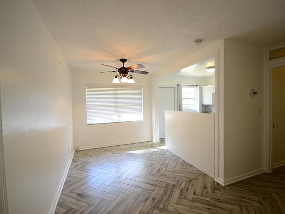 Large dining area is light-filled and is open to the kitchen