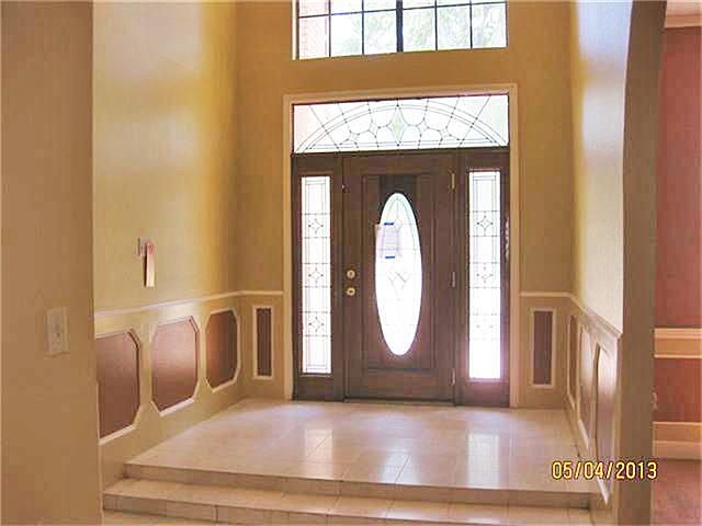 Enter through the Leaded Mahogany front door into the Soaring 2 story foyer.