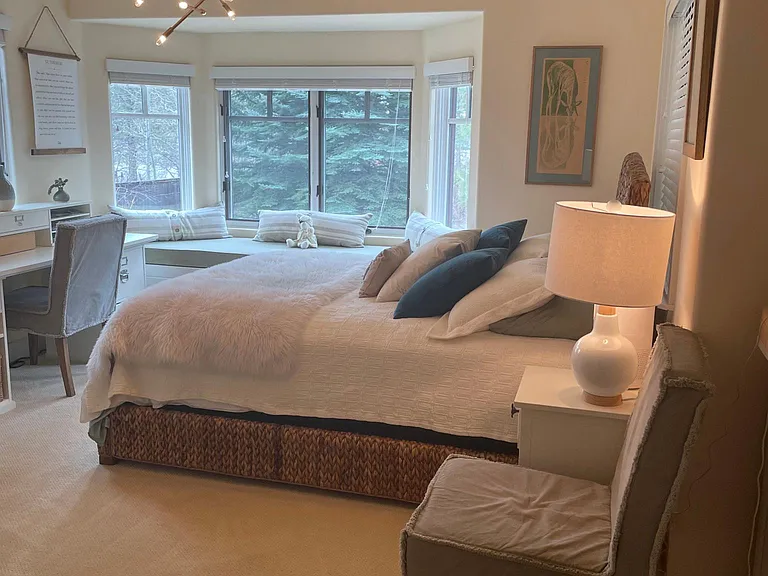 Upstairs bedroom with en suite bathroom and window seat