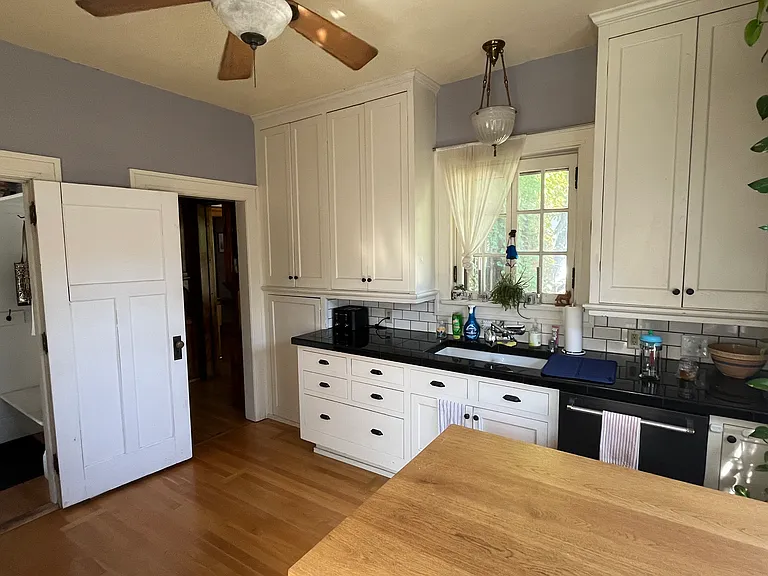 Spacious chef's kitchen with dine-in island. Fully stocked for your cooking adventures and plenty of storage!