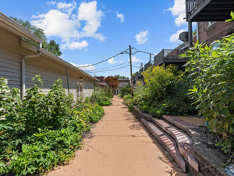 Rear courtyard w/ community garden