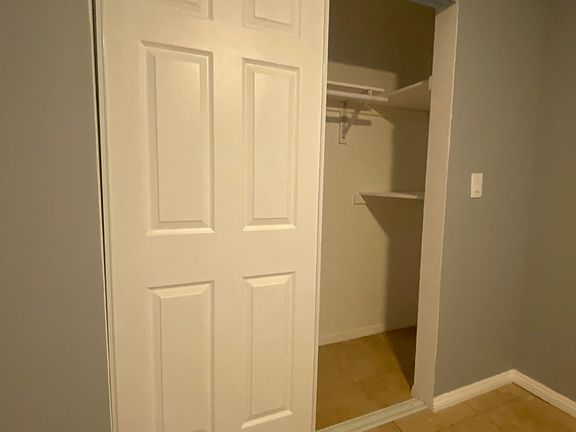 Spacious closet with shelves
