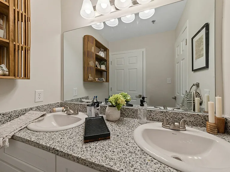 Elegant Bathroom with Double Vanity and Granite Counters