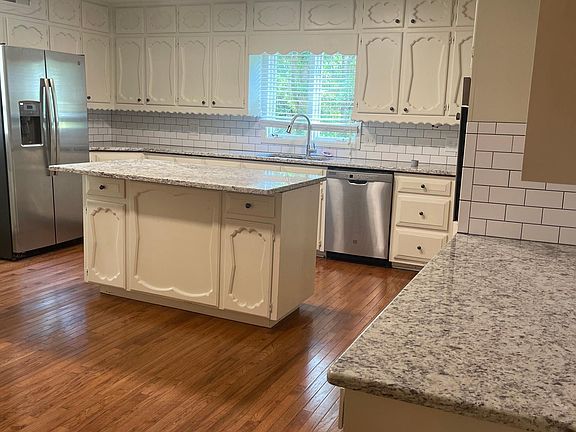 Large kitchen with island, new granite countertops abs stainless steel appliances