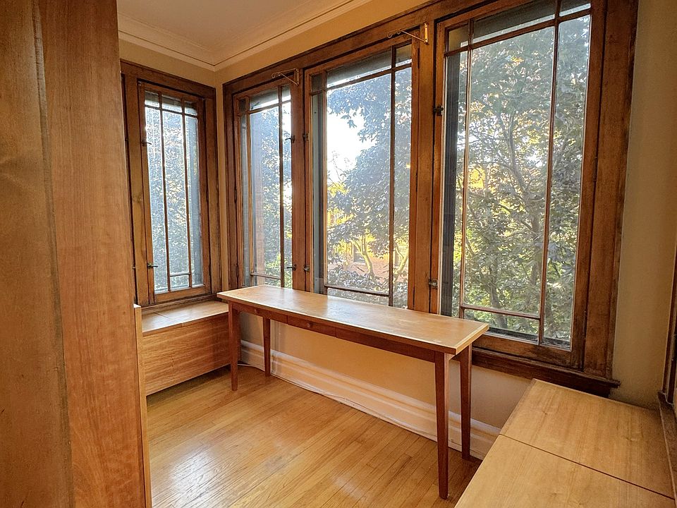 Sunroom/office w/ custom furniture & built-in cabinet!