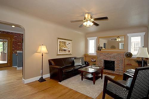 Living room with hardwood floors and a fireplace