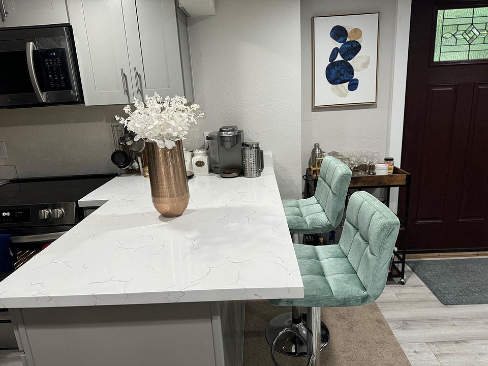kitchen with island and barstools