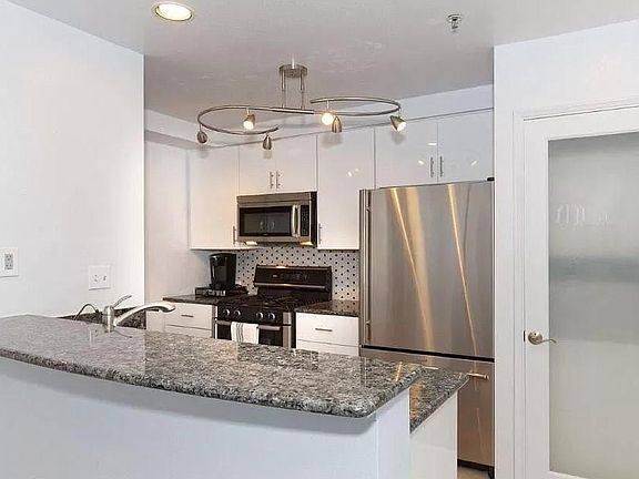 Kitchen with counter opening on dining room