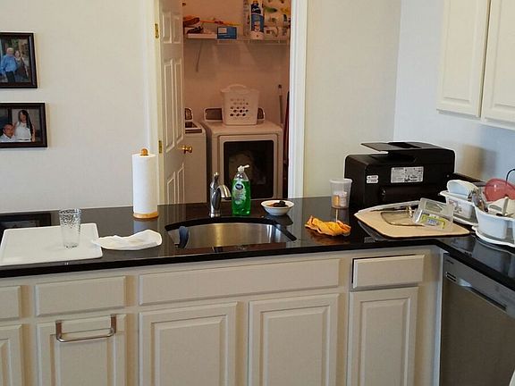 Laundry room behind kitchen