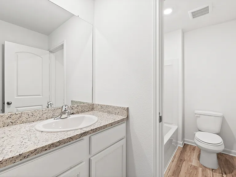 Additional full bath located upstairs.