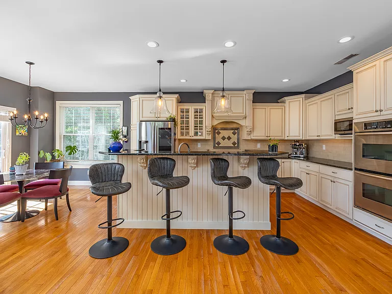 Open Floor plan bringing the kitchen and TV room together with light