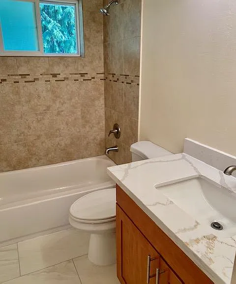 Recently updated main bath with tub/shower, quartz counter top and tile flooring