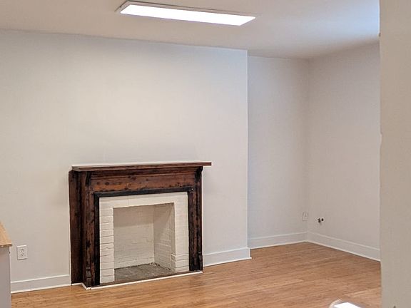 LR fireplace. note great lighting in 200+ sq ft LR