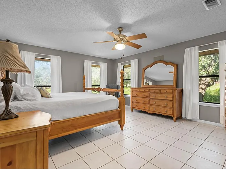 Master bedroom with on suite bathroom and california king bed