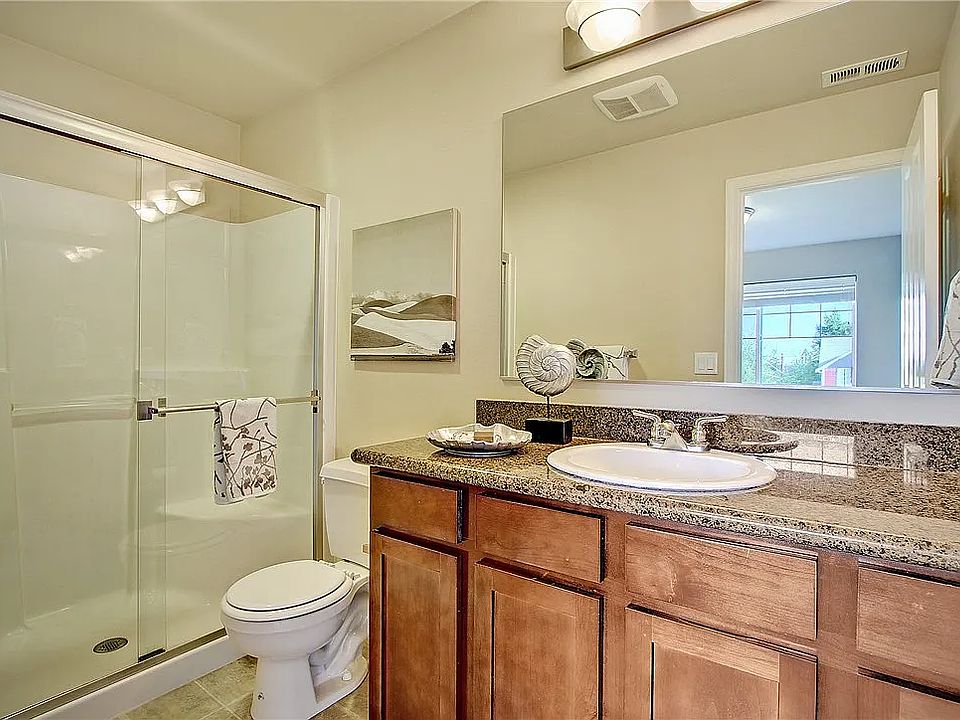 Attached master bathroom with standing shower.