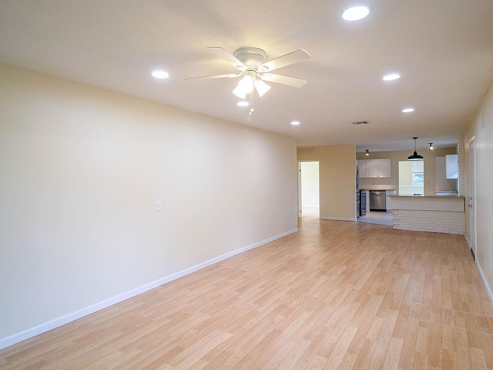 Living room into kitchen and other 2 bedrooms