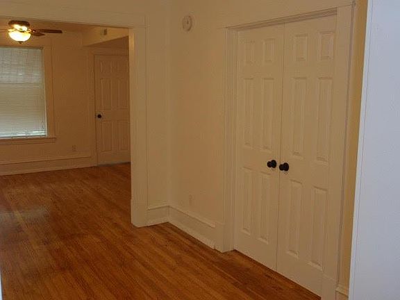 Bedroom doors, looking into the living room from the dining room