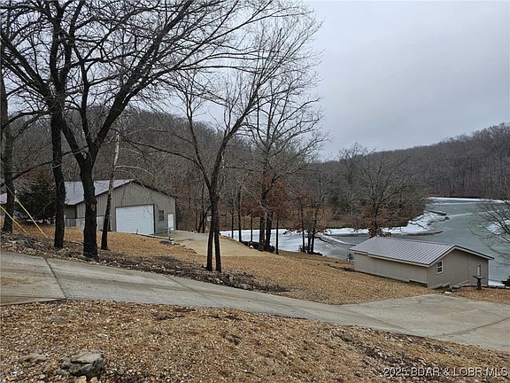 Garage property with .98 ac 246' LF