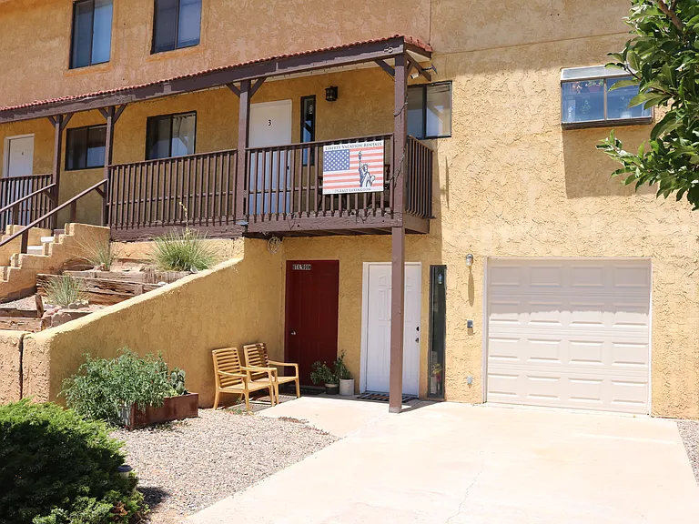 Front of building and parking area for your vacation rental (#2)

Sorry, the garage is being used for storage, and currently not viable for parking. You may park in front of the garage door.