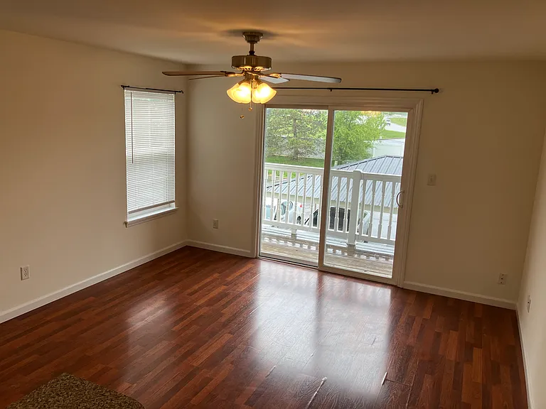 View of living room. Leads to the deck/balcony.